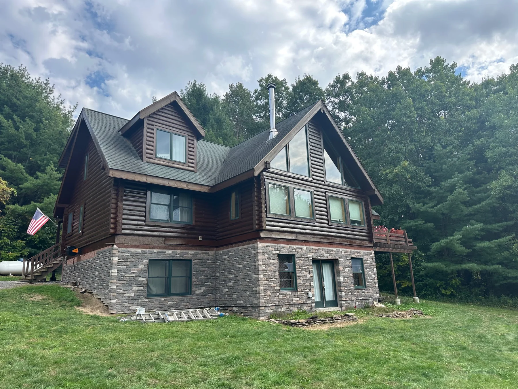 Log home before the deck and gable addition project