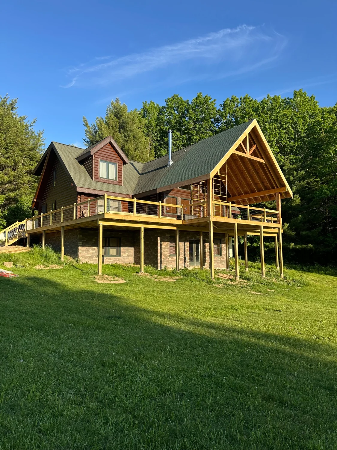 New elevated deck and covered gable addition during construction